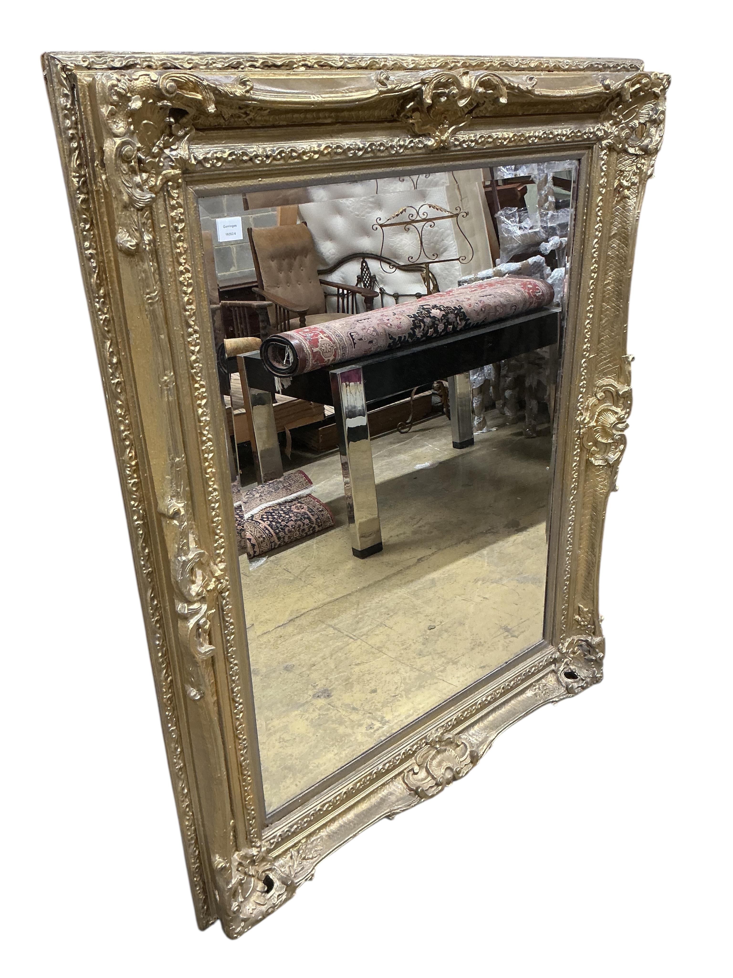 A large giltwood and composition overmantel mirror, width 127cm, height 160cm